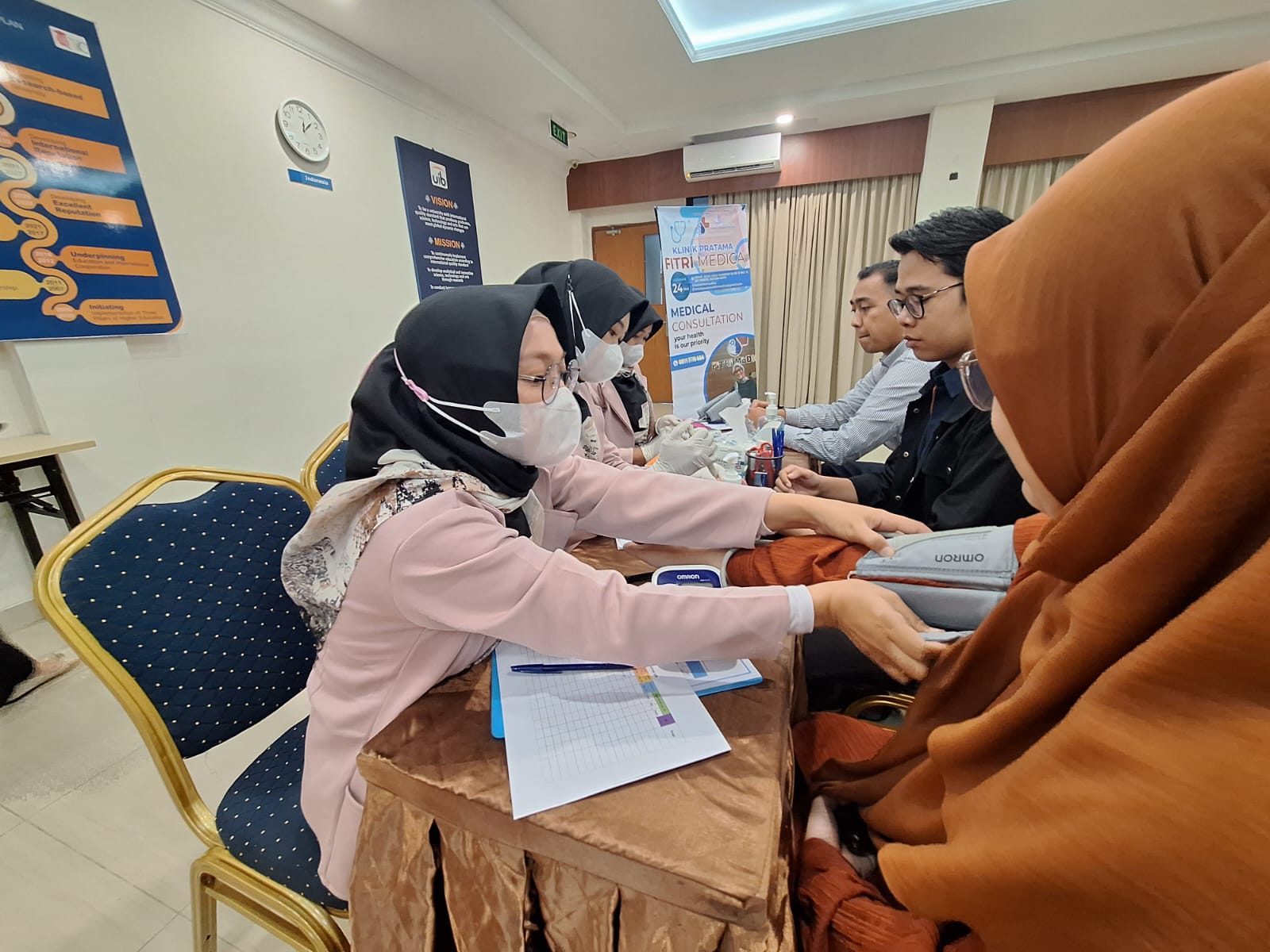 A group of people sitting at a table

Description automatically generated