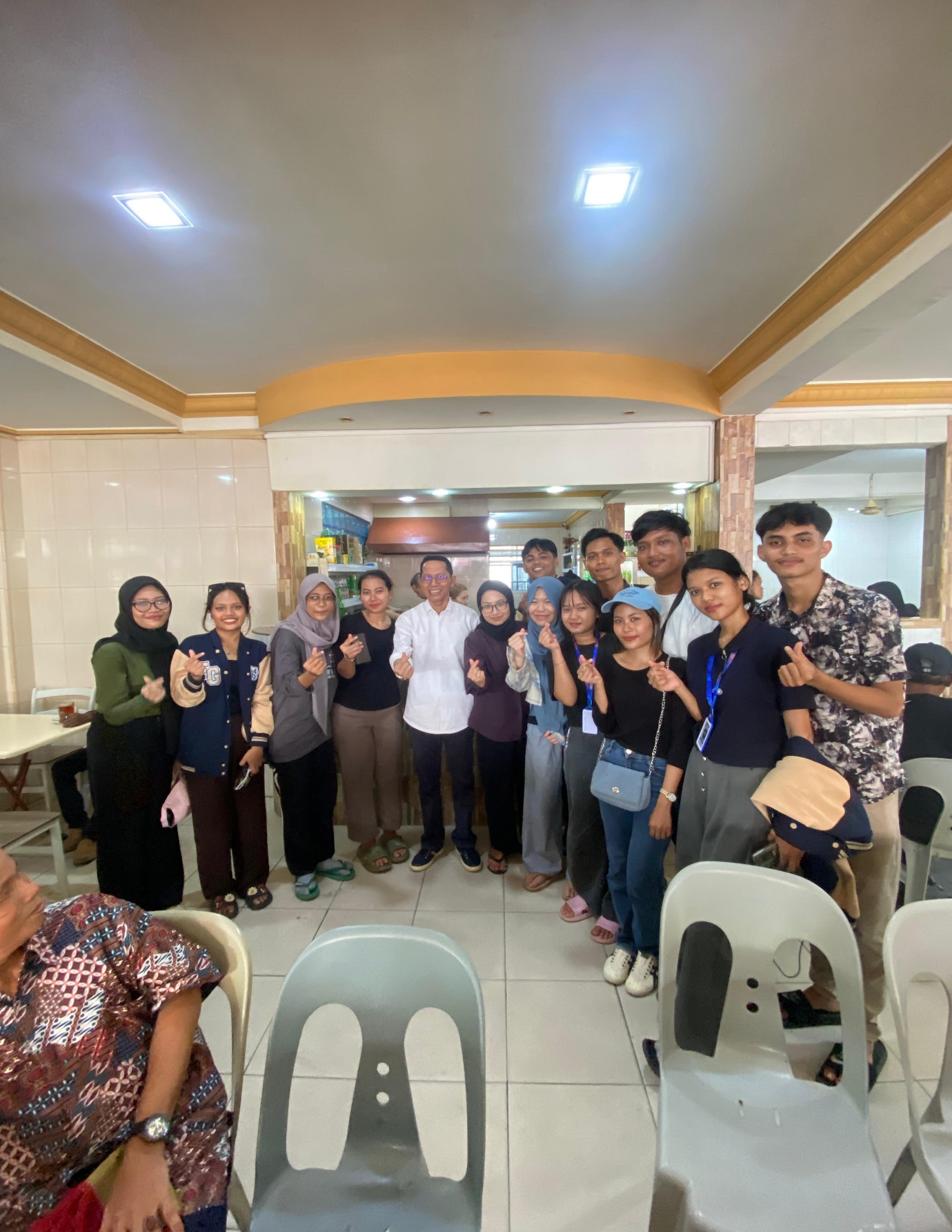 A group of people posing for a photo

Description automatically generated