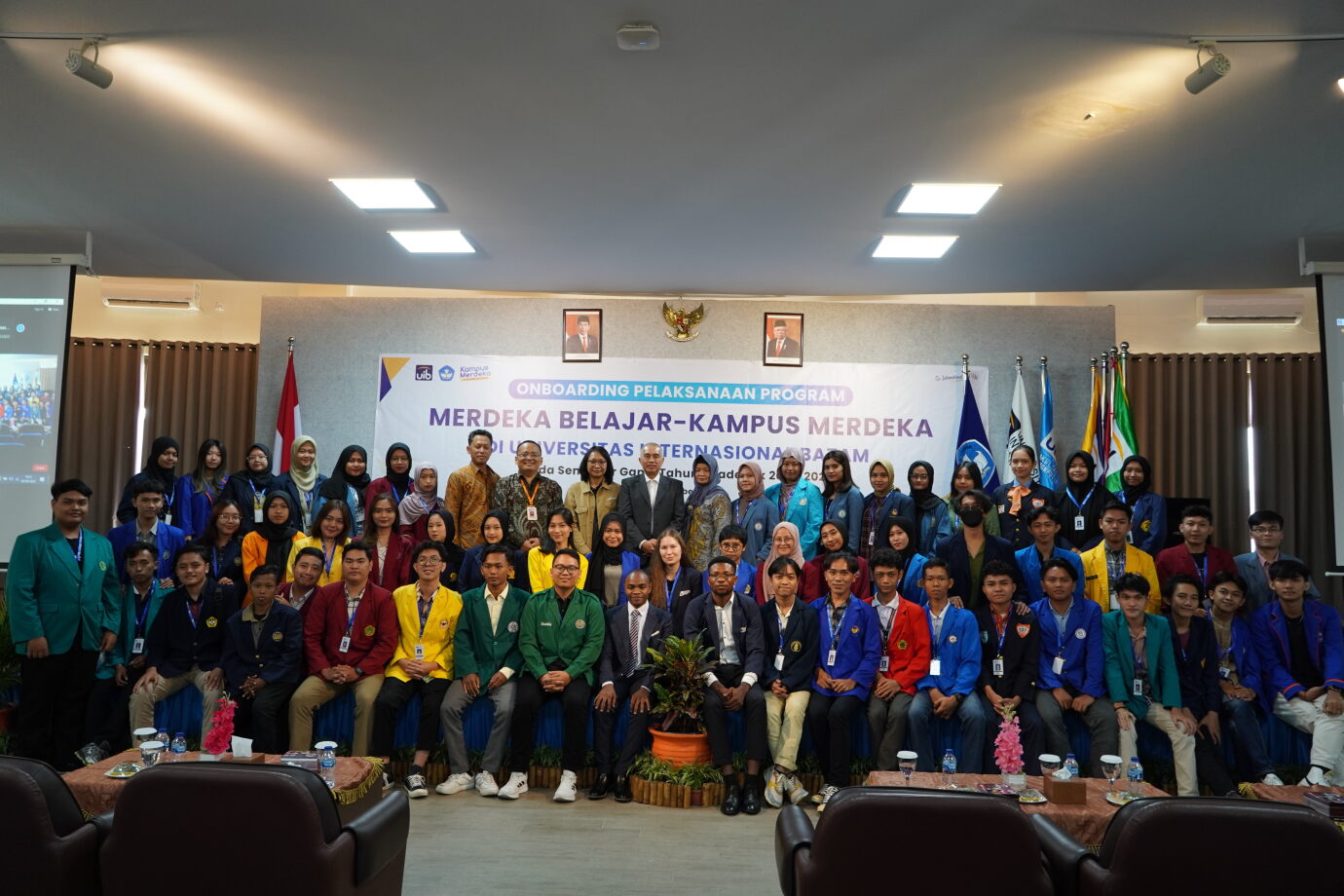 A group of people posing for a photo
Description automatically generated