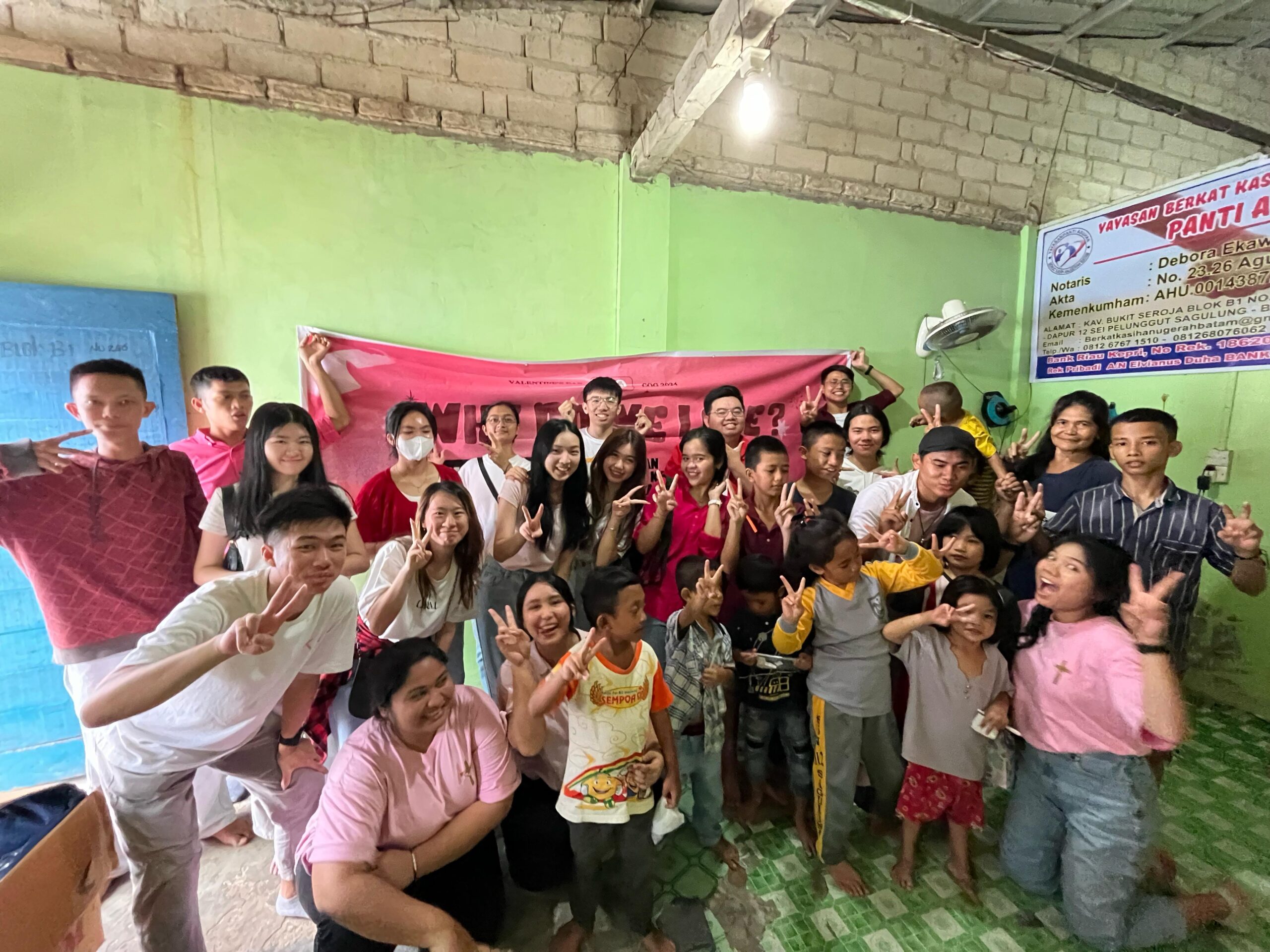 A group of people posing for a photo

Description automatically generated