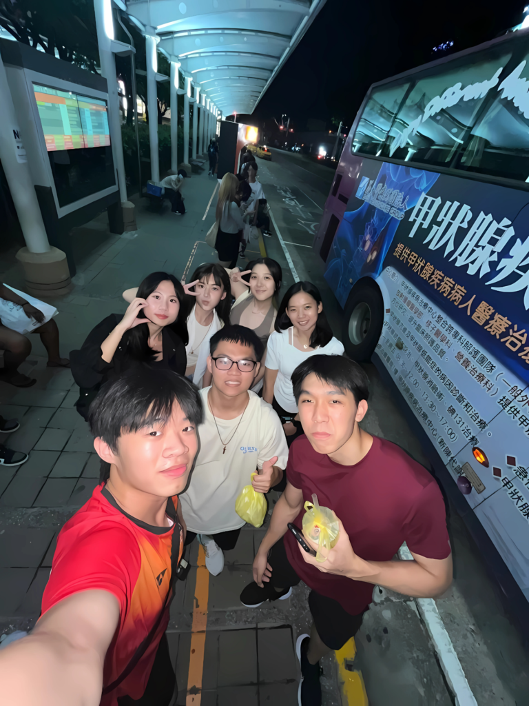 A group of people standing on a sidewalk AI-generated content may be incorrect.