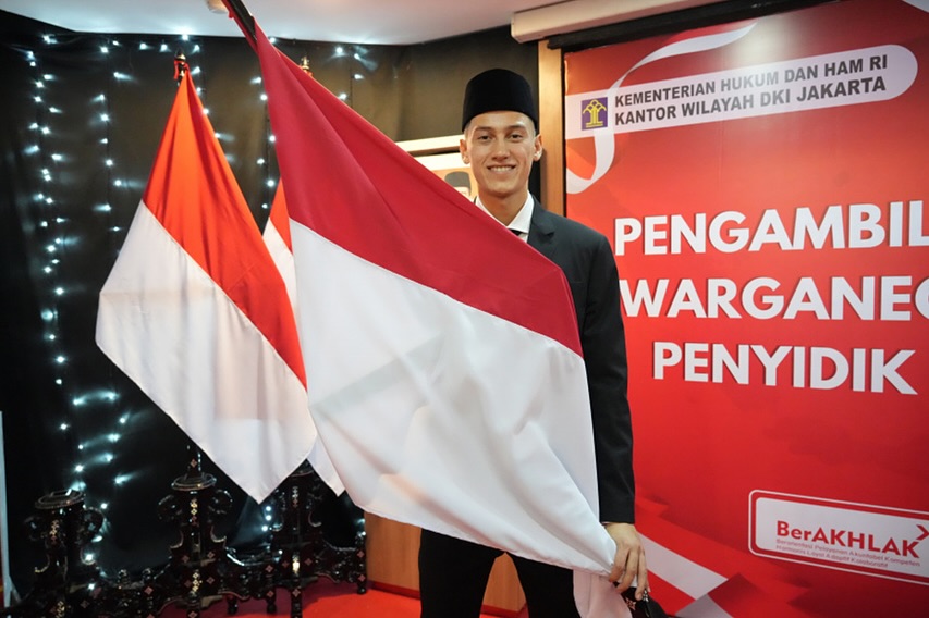 A person holding a flag AI-generated content may be incorrect.