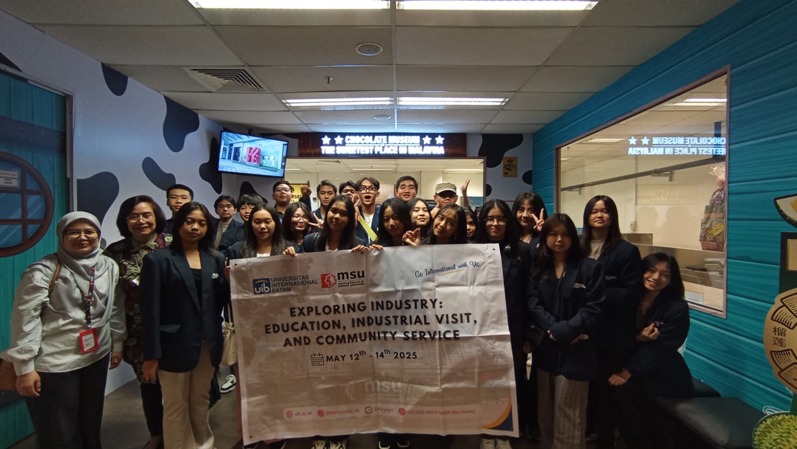 A group of people holding a sign

AI-generated content may be incorrect.