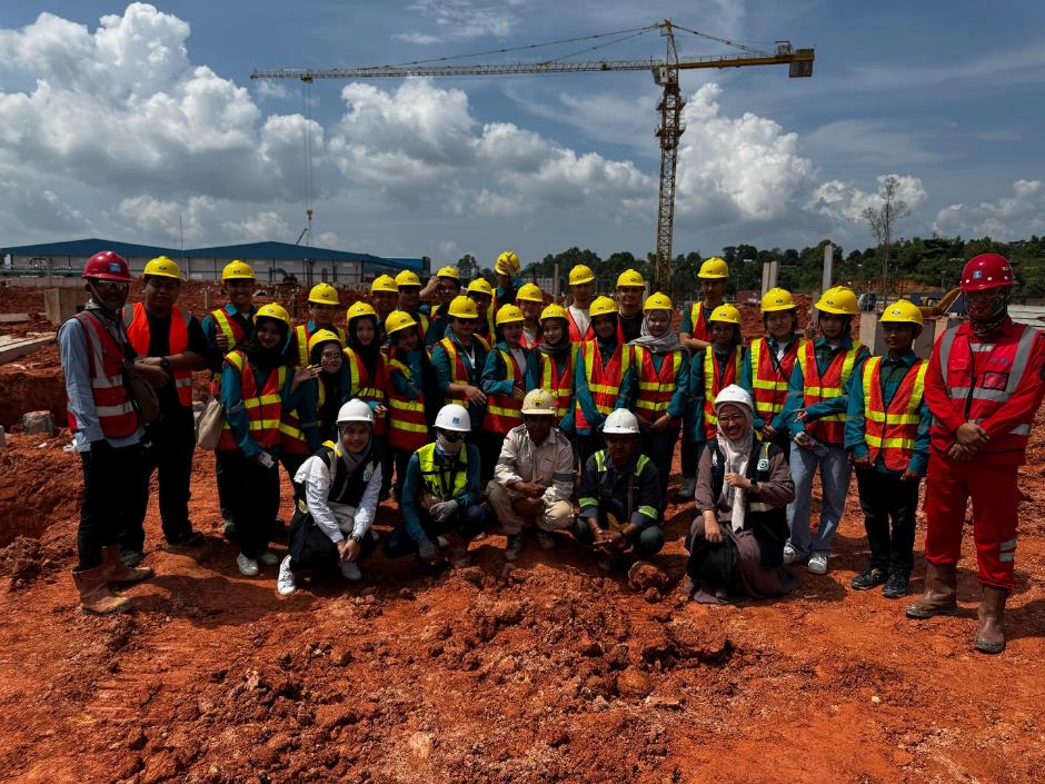 A group of people in hard hats Description automatically generated