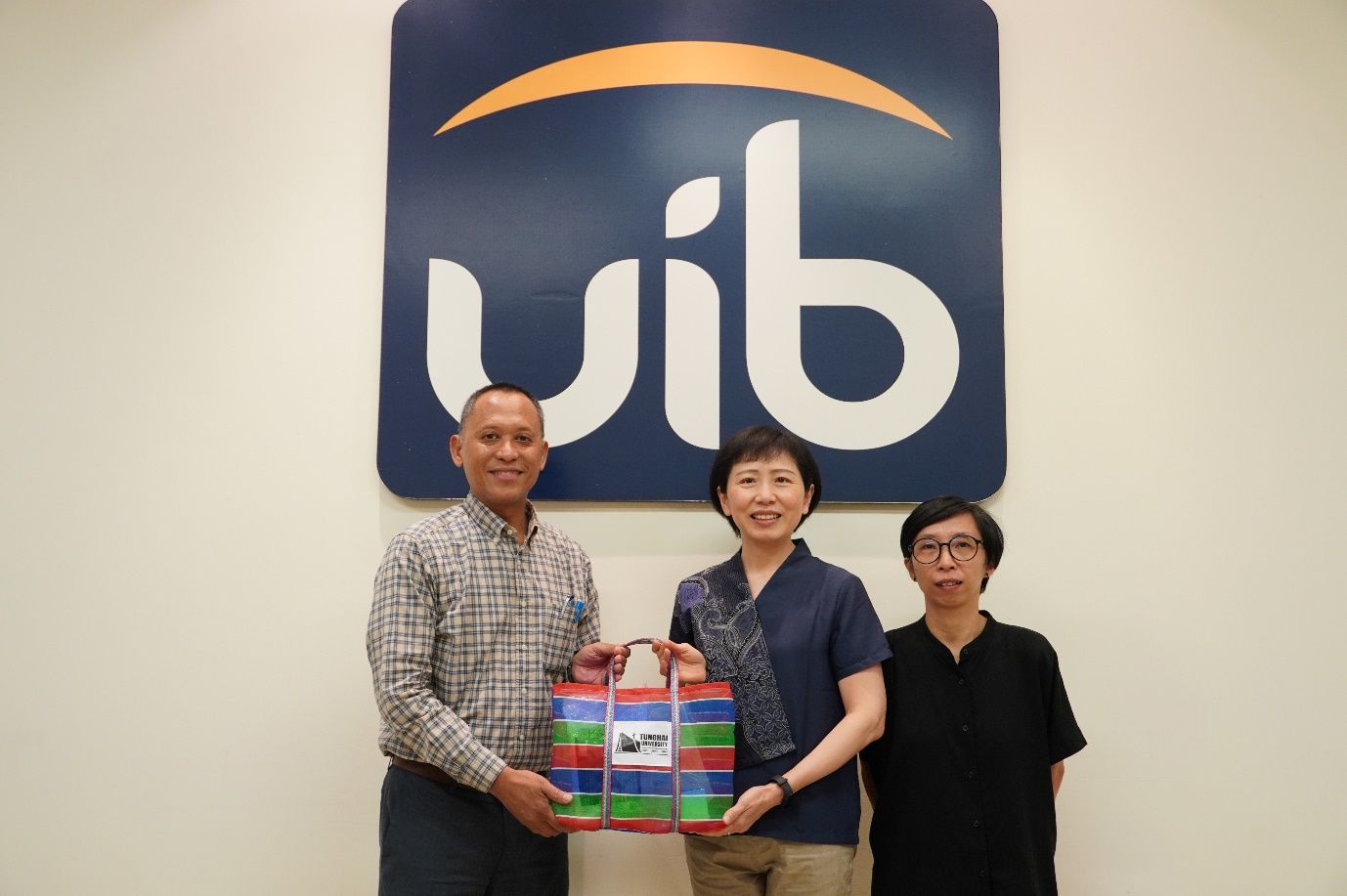 A group of people posing for a photo AI-generated content may be incorrect.