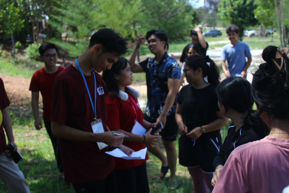 A group of people standing outside AI-generated content may be incorrect.