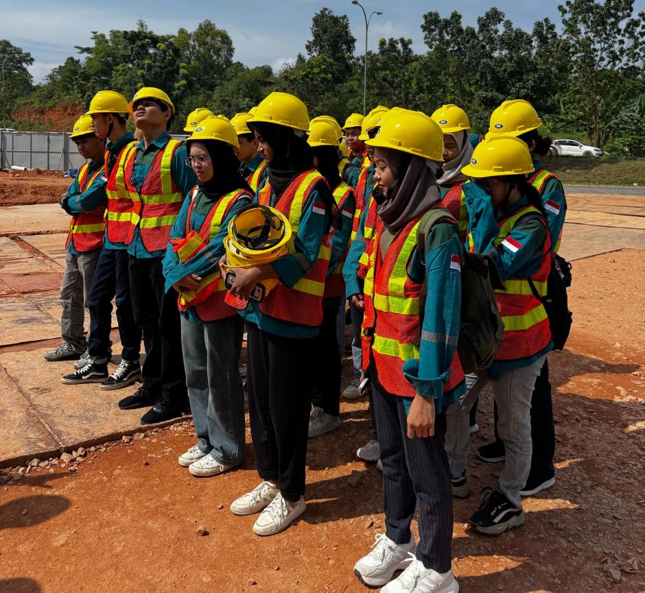 A group of people wearing yellow helmets

Description automatically generated