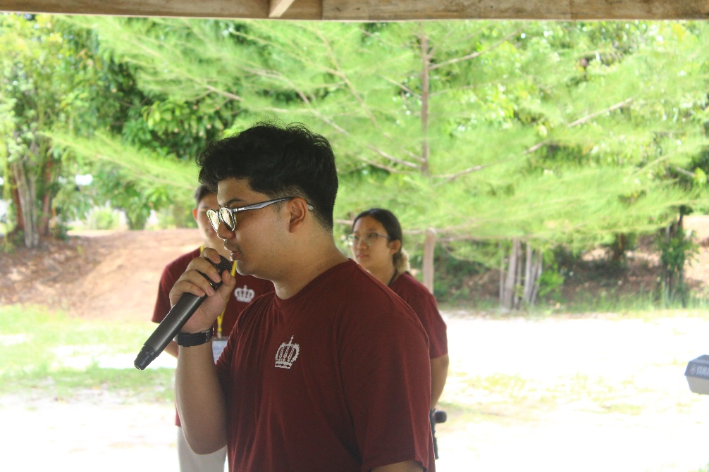 A person holding a microphone AI-generated content may be incorrect.