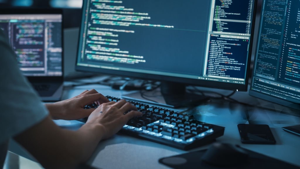 A person typing on a keyboard AI-generated content may be incorrect.
