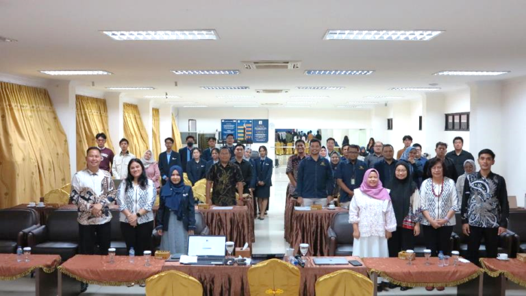 A group of people standing in a room AI-generated content may be incorrect.