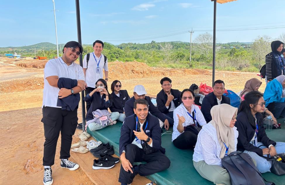 A group of people sitting under a canopy

Description automatically generated