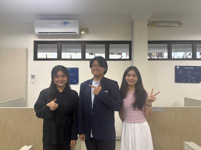 A group of people posing for a picture AI-generated content may be incorrect.