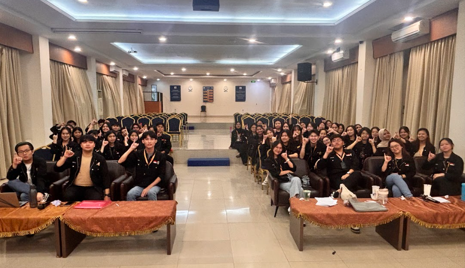 A group of people sitting in chairs in a room

AI-generated content may be incorrect.