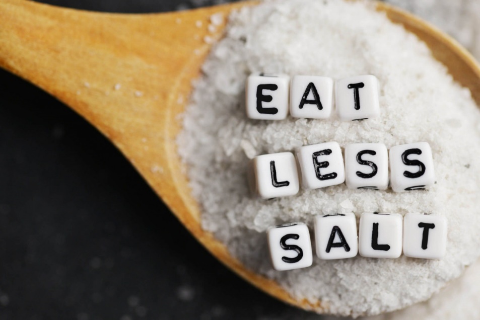 A wooden spoon with white salt and letters on it

AI-generated content may be incorrect.