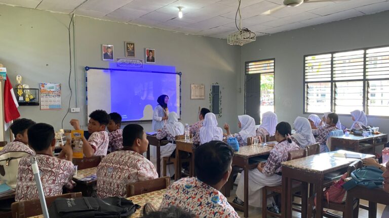 A group of people in a classroom Description automatically generated