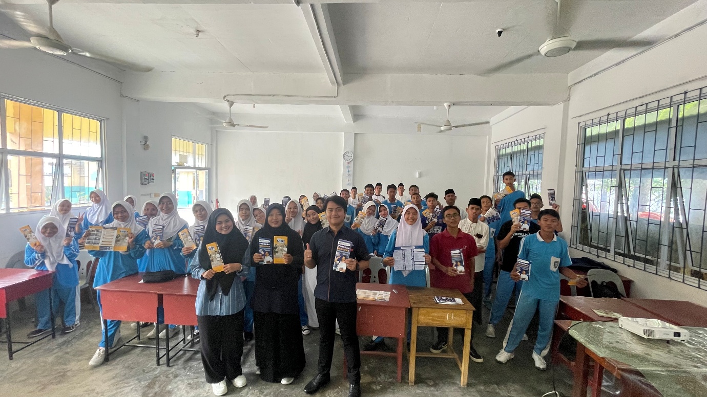 A group of people in a room
Description automatically generated