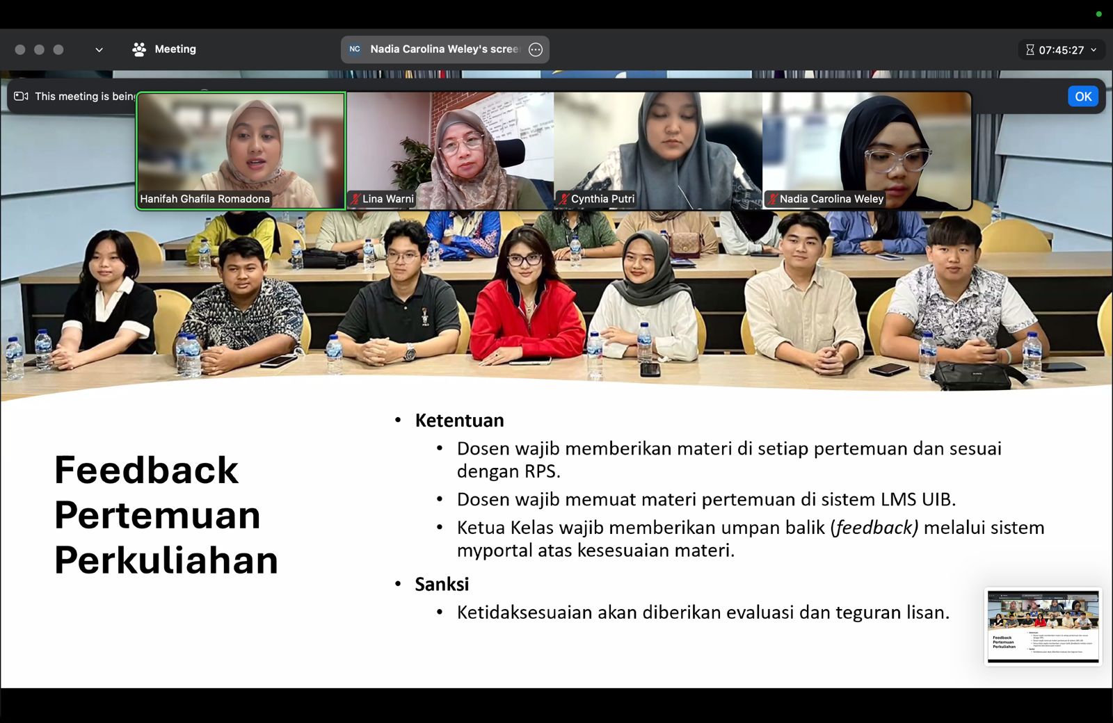 A group of people sitting in a row

Description automatically generated