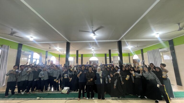 A group of people standing in a room Description automatically generated