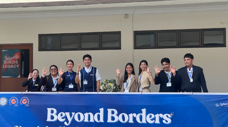 A group of people standing in front of a banner AI-generated content may be incorrect.