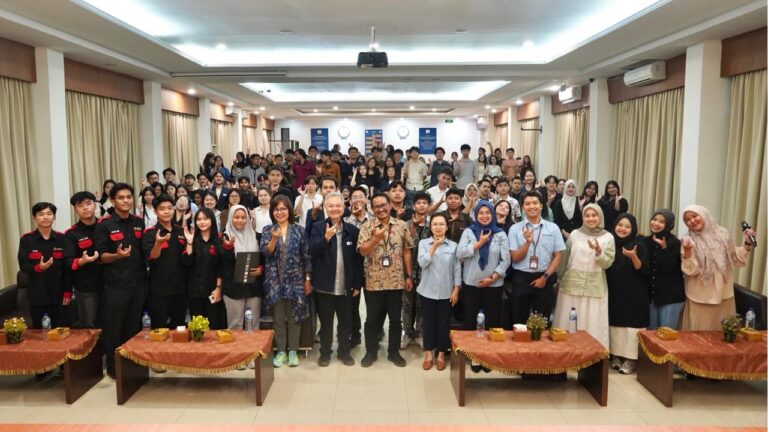 A group of people standing together Description automatically generated