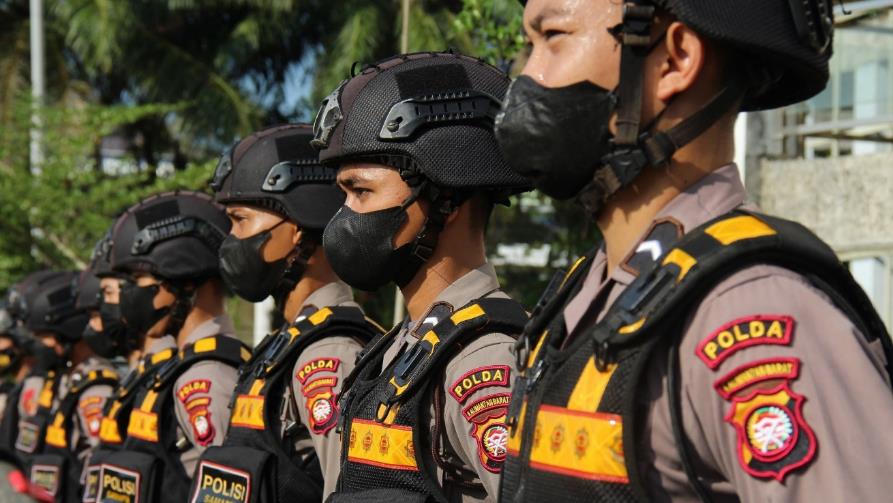 A group of police officers in uniform AI-generated content may be incorrect.