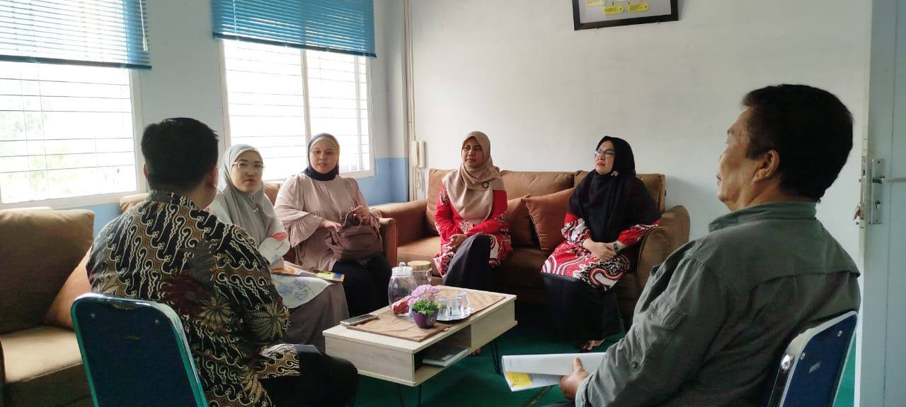 A group of women sitting on a couch Description automatically generated