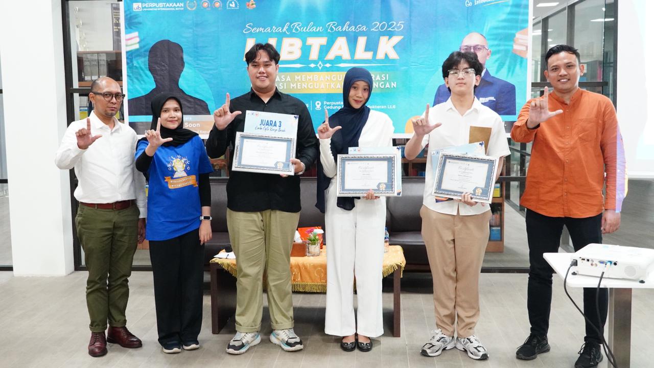 A group of people holding certificates
Description automatically generated