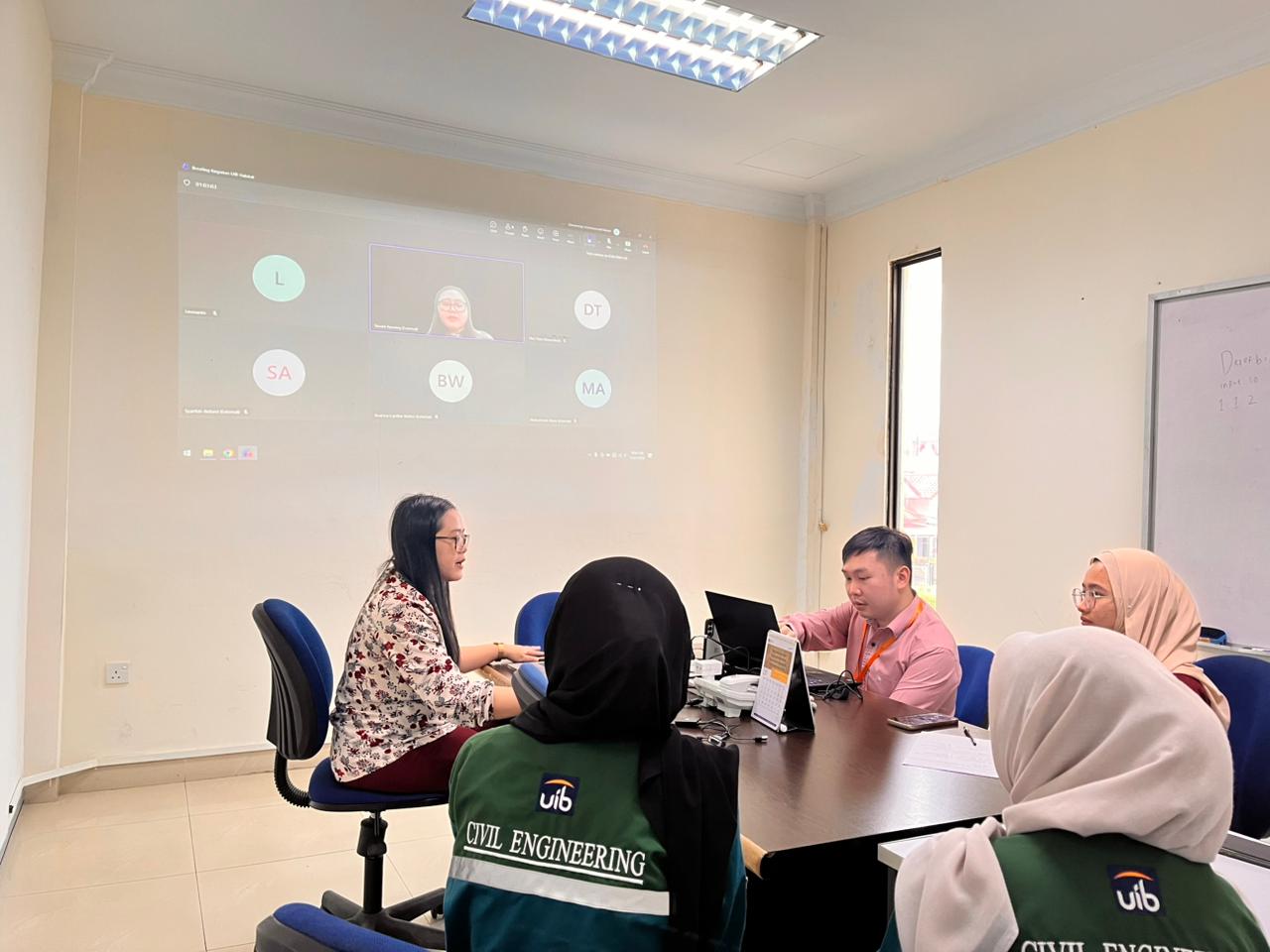 A group of people in a meeting

AI-generated content may be incorrect.