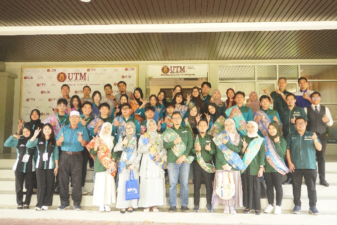 A group of people posing for a photo AI-generated content may be incorrect.