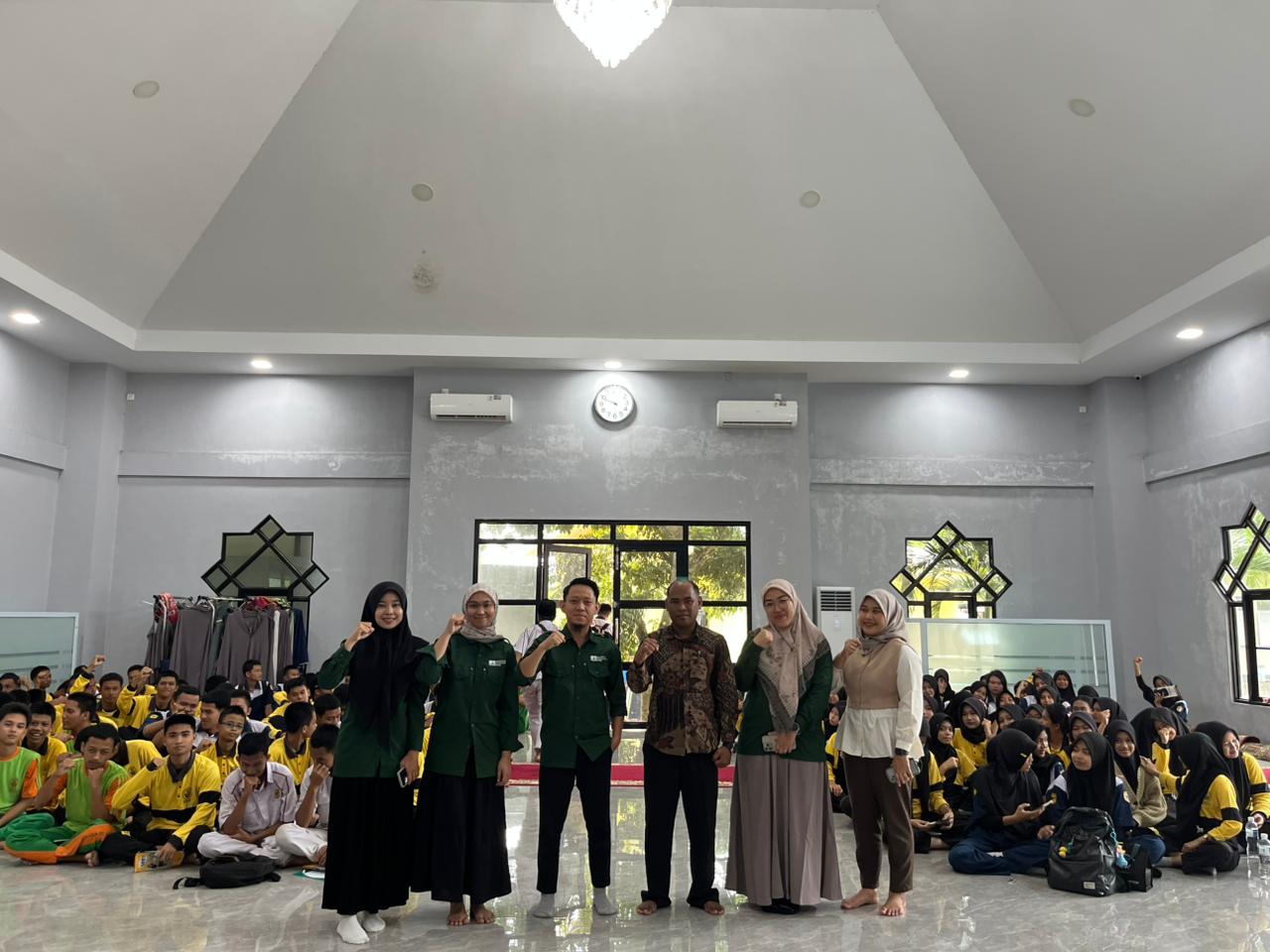 A group of people posing for a photo

Description automatically generated