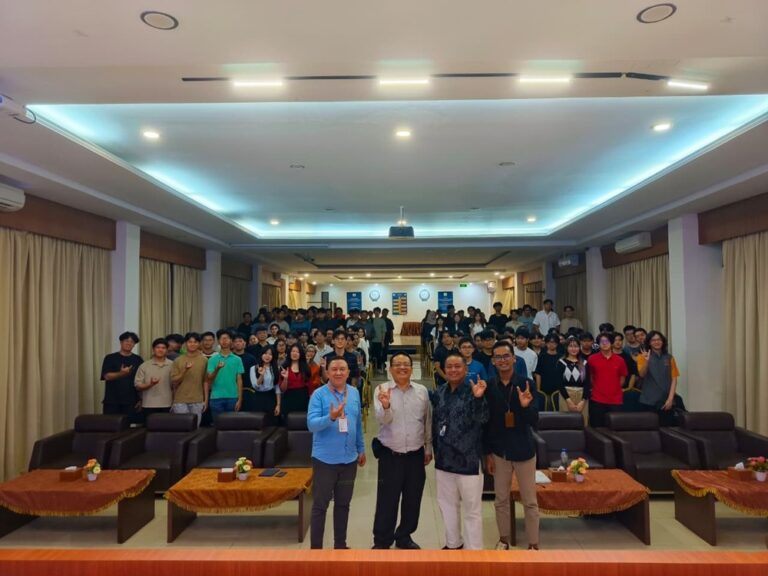 A group of people standing in a room AI-generated content may be incorrect.