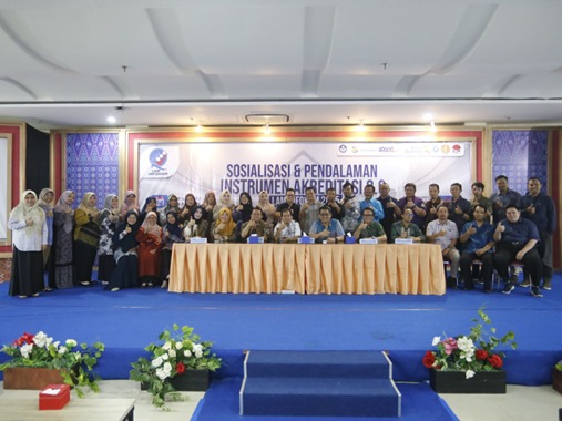 A group of people standing in front of a blue carpet AI-generated content may be incorrect.