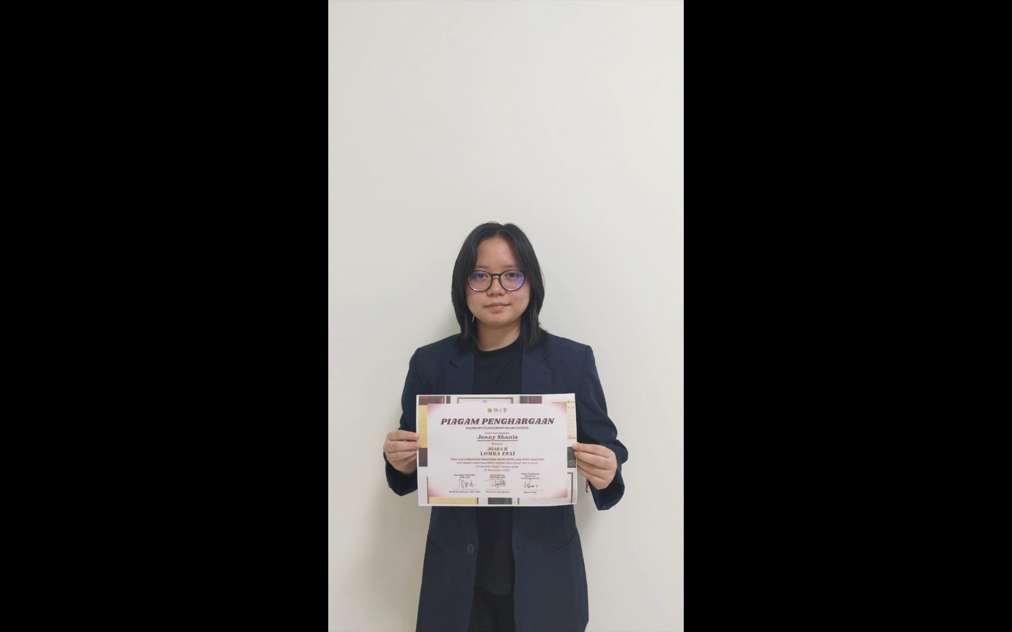 A person holding a paper Description automatically generated