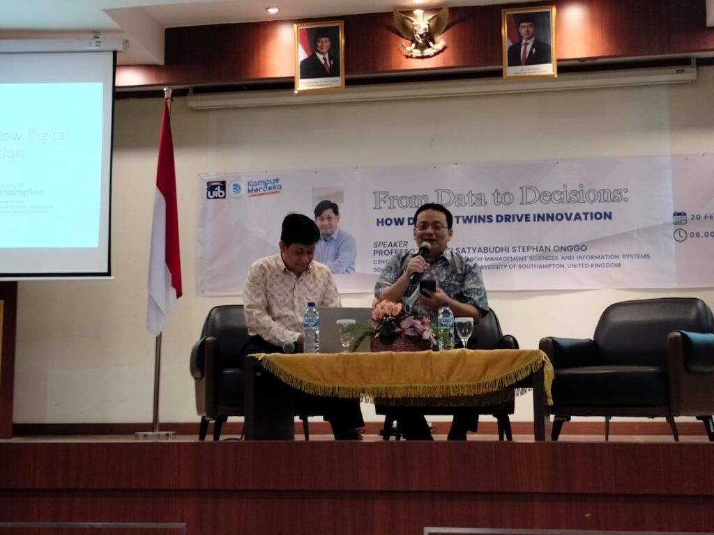 A person sitting at a table with a microphone AI-generated content may be incorrect.