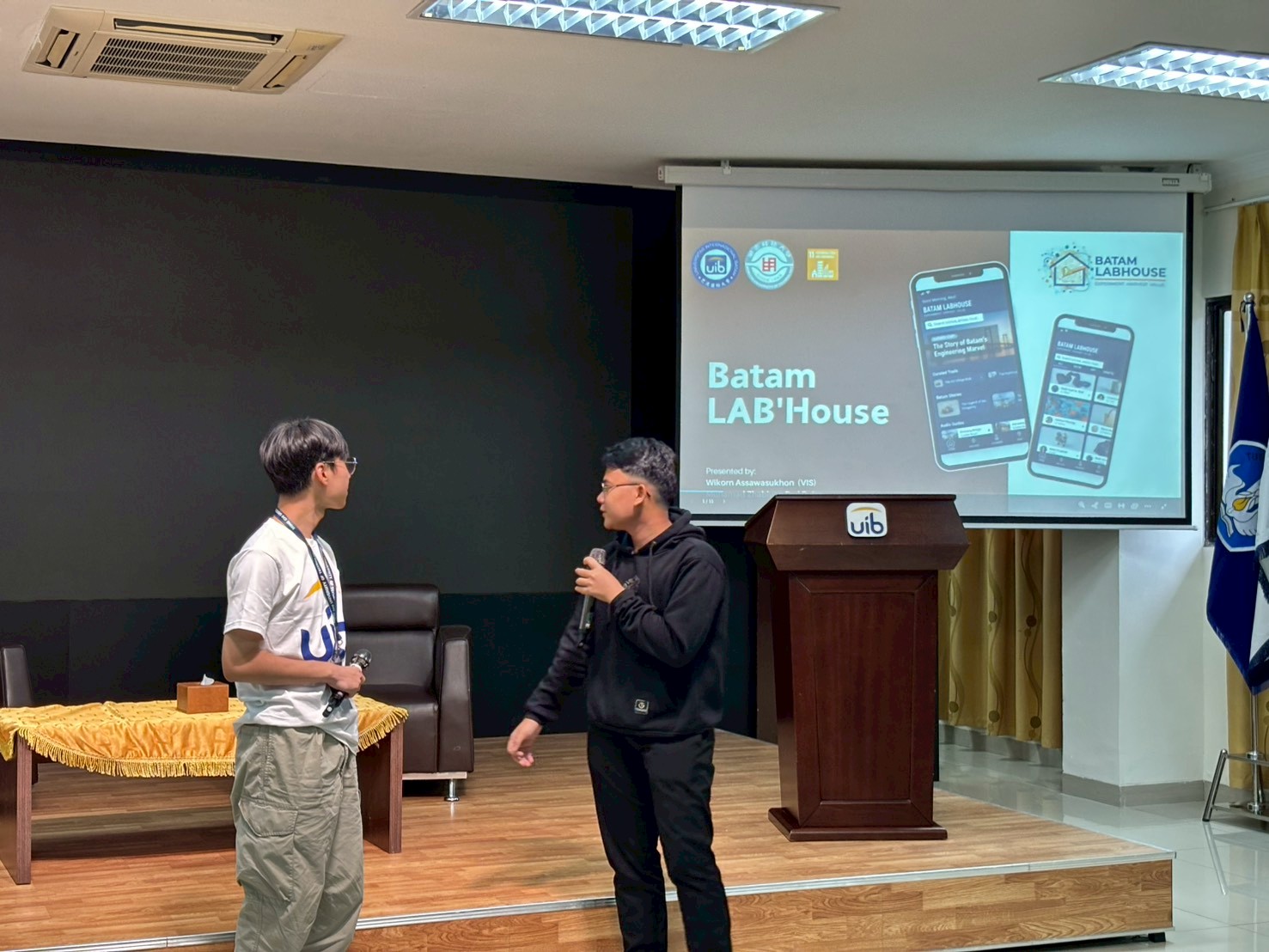 A person standing in front of a podium with a screen on it
AI-generated content may be incorrect.