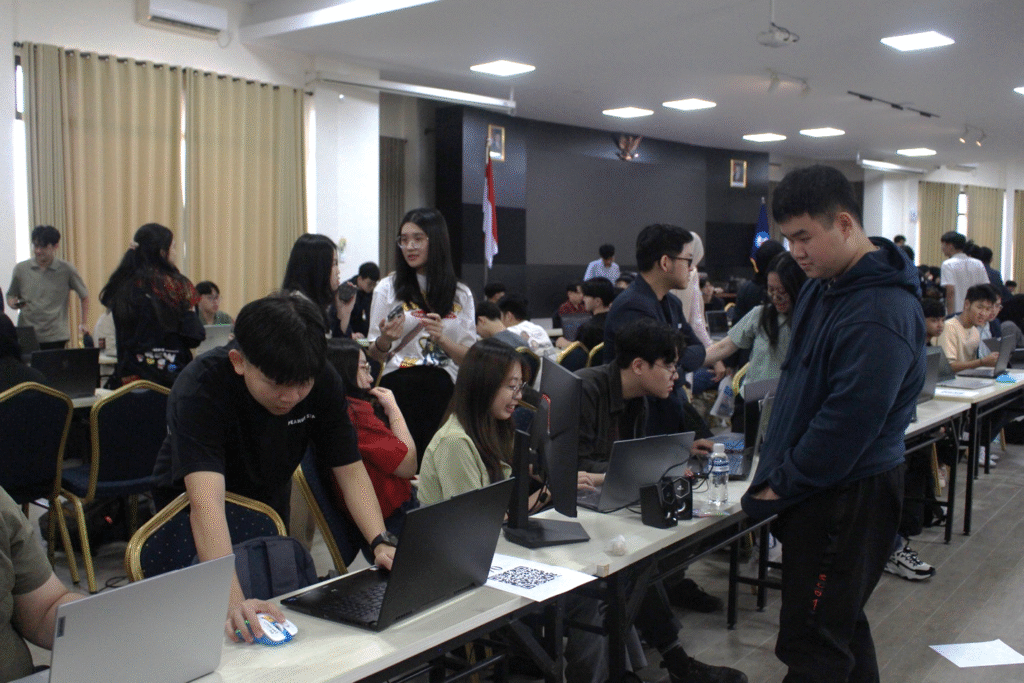A group of people in a room with laptops AI-generated content may be incorrect.