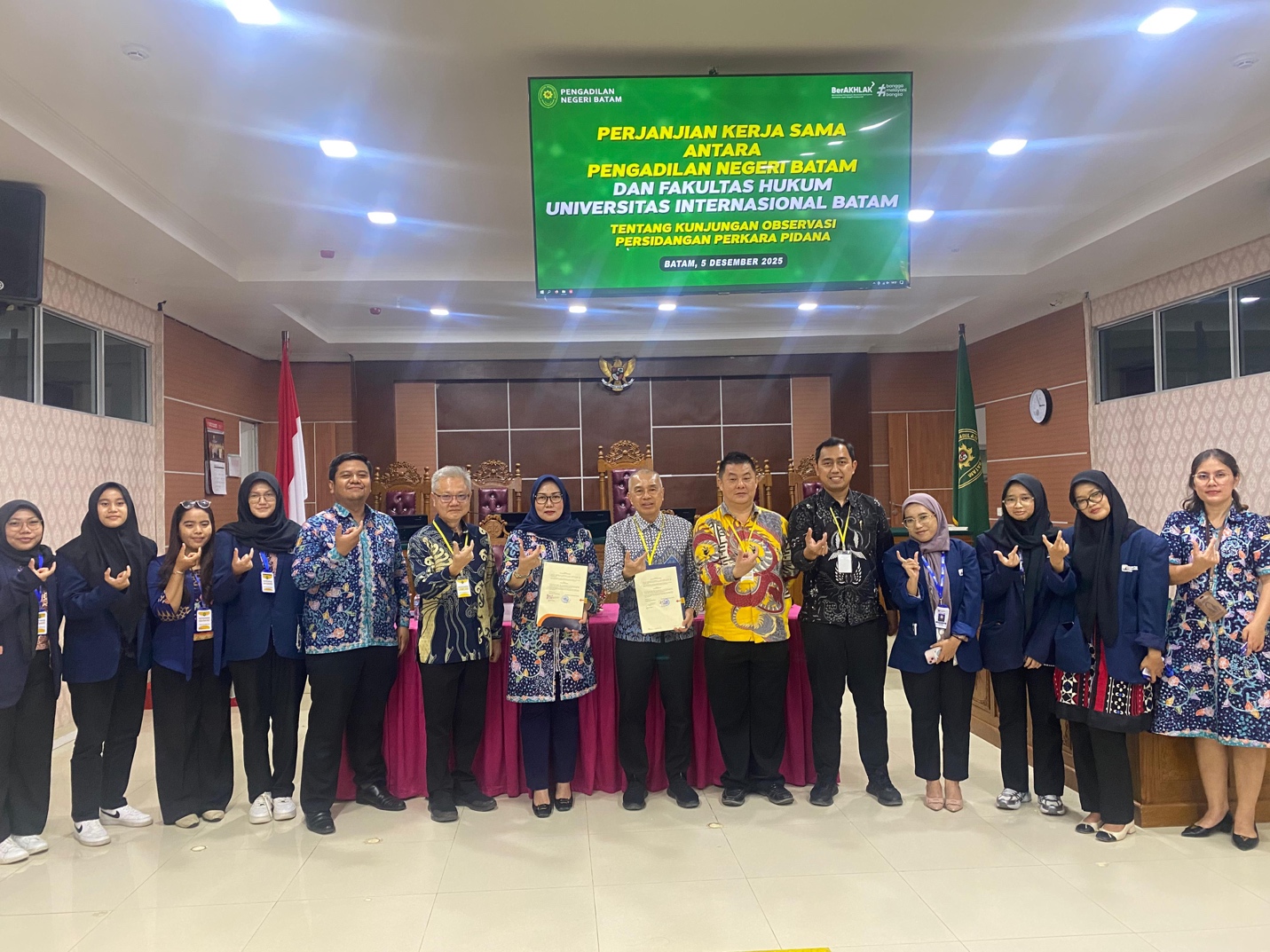 A group of people posing for a photo Description automatically generated