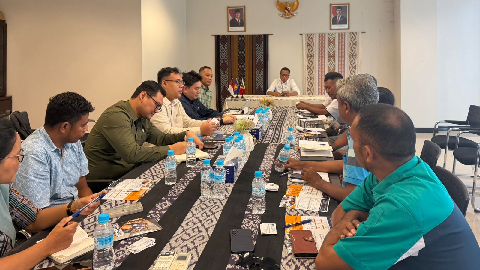 A group of people sitting at a table Description automatically generated