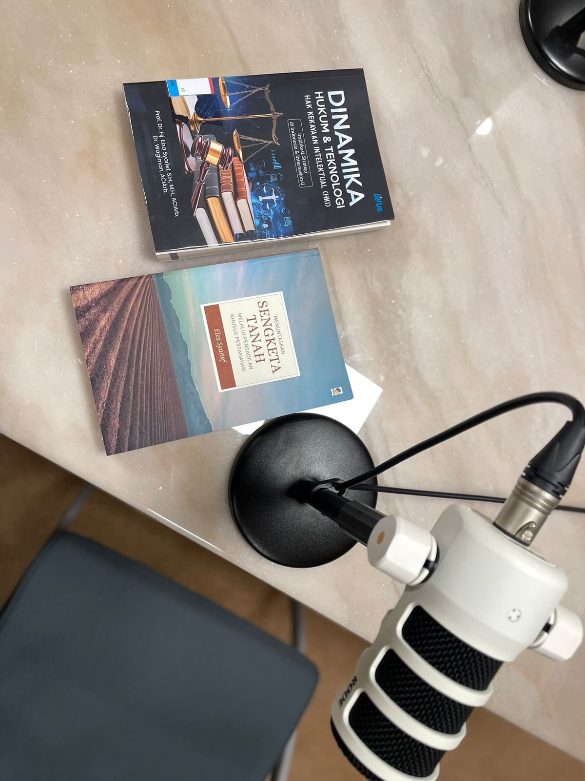 A microphone and cd cases on a table

AI-generated content may be incorrect.