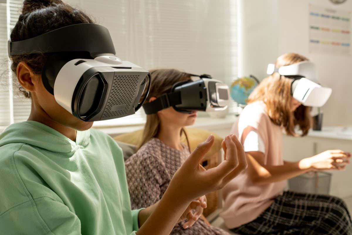 Children wearing VR headsets
