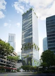 A tall building with trees and cars in the background AI-generated content may be incorrect.